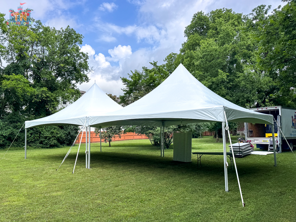 Wedding tent with string lighting at an evening reception in Nashville TN